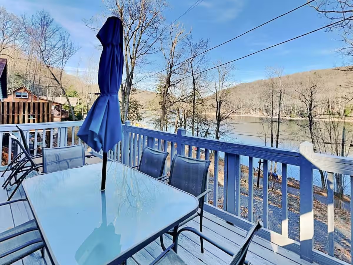 Outdoor dining table on the first stay's deck overlooking Deep Creek Lake.