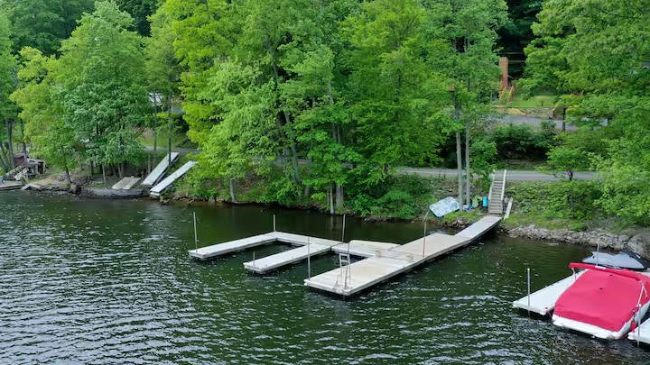 Lakefront dock area at the first stay with slips extending into Deep Creek Lake.